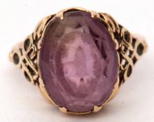 Antique yellow metal and amethyst ring, the pale oval faceted amethyst raised in a coronet mount