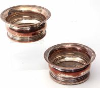 Pair of 19th century silver on copper bottle coasters, each with flared and beaded rims and ring