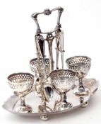 Early 20th century electro-plated egg stand, the shaped oval base set with four egg cups, each