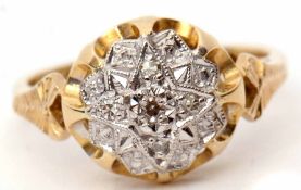 18ct gold and diamond cluster ring, the circular panel with a star engraved setting and set with