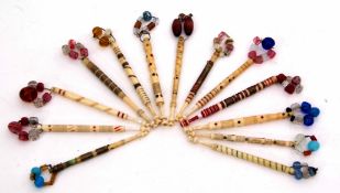 Mixed Lot: comprising 13 various bone and glass lace bobbins, five with additional brass wire work