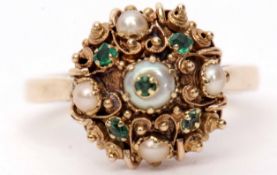 9ct gold emerald and seed pearl cluster ring, the circular shaped panel with an Etruscan style