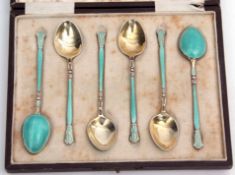 Cased set of six silver gilt and enamel coffee spoons with engine turned and light blue enamel