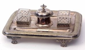 Late 19th century electro-plated ink stand of rectangular form with twin pen rests flanking clear