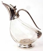 Modern electro-plate mounted and clear glass claret jug, the shaped and polished throat with