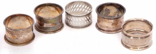 Mixed Lot: comprising three matching cylindrical napkin rings together with two further examples,