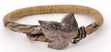 Antique mourning bracelet of plaited hair, with silver leaf designed entwined terminal