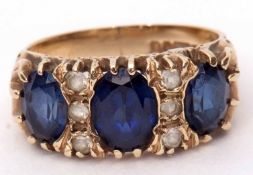 9ct gold blue and white paste set ring, all set in a carved scroll and polished mount, Birmingham