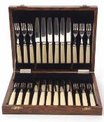 Early 20th century oak cased canteen of 12 each dessert knives and forks, each with polished