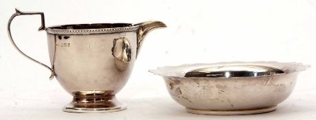 Mixed Lot: comprising a hallmarked small cream jug, together with a small sugar bowl, combined