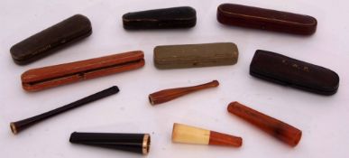 Mixed Lot: comprising five various cased cheroot and cigarette holders, one with 9ct gold hallmarked