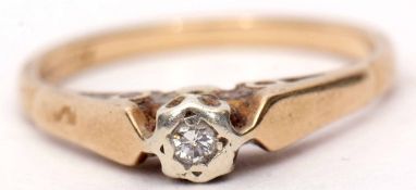 9ct gold and diamond single stone ring, the small bezel set diamond raised in upswept shoulders to a