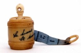 Late 19th/early 20th century French vegetable ivory carved tape measure of barrel form with twist