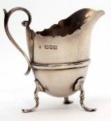 Late Victorian cream jug, with gold body, cast and applied handle and three feet, height 9cm, weight