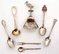 Mixed Lot: comprising seven various silver and white metal spoons and a fork, combined weight approx