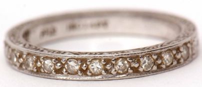 Precious metal diamond half-eternity ring, featuring 12 small diamonds set in an engraved mount,