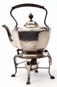 Early 20th century electro-plated tea kettle on stand of faceted and oval form with hinged cover and