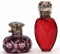 Mixed Lot: comprising two various Victorian cut glass scent bottles, the first of ovoid form with