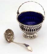 Edward VII swing handled sugar basket of pierced cylindrical form with hinged handle and cobalt blue