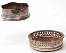 Mixed Lot: comprising two various silver on copper bottle coasters, each with shaped rims and with