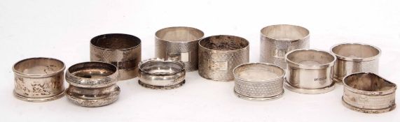 Mixed Lot: comprising eleven various hallmarked silver napkin rings, combined weight approx