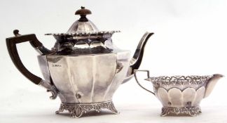Edward VII bachelor's tea pot and milk jug of faceted circular form with flared rim, hinged and