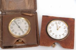 Mixed Lot: comprising two various leather mounted 8-day bedroom timepieces (both with incomplete