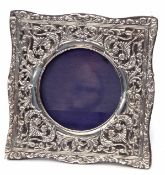 Edward VII silver mounted easel backed photograph frame, the floral and foliate pierced square