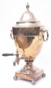 Early 20th century electro-plated tea urn of polished circular form with girdled body, pull off