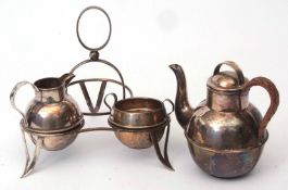 Early 20th century electro-plated tea set on stand and comprising bachelor size tea pot, milk jug