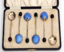 Cased set of six silver gilt and enamelled coffee bean finial coffee spoons of typical form with