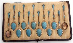 Cased set of twelve Norwegian Victorian silver gilt and enamelled coffee spoons, of frosted gilt