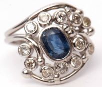 Custom made 9ct white gold sapphire and diamond cluster ring, the oval shaped centre sapphire