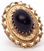 Early 20th century 9ct gold and amethyst dress ring, the large oval Etruscan style mount set with