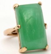 Modern 9ct gold and jadeite ring, the rectangular shaped cabochon panel, six claw set in a basket