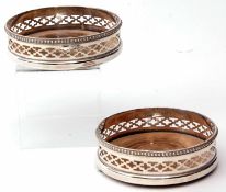 Pair of early 20th century electro-plated bottle coasters each with shaped and beaded rims and