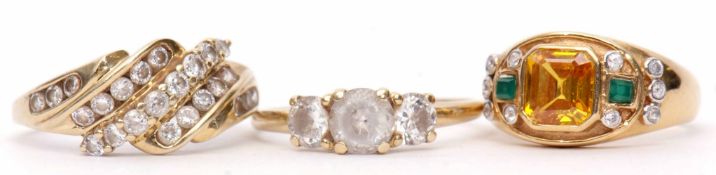 Three 9ct gold cubic zirconia and paste set dress rings, gross weight 13.9gms