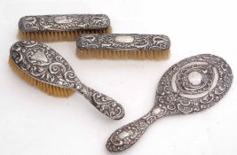 Mixed Lot: comprising a heavily embossed dressing table hand mirror, single hair brush and two