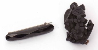 Vintage vulcanite anchor brooch together with a similar faceted bar brooch (2)