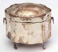 George V canister of shaped oval form with hinged and domed cover, side hinged handles and raised on