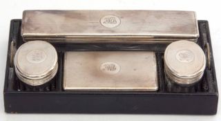 Part dressing table set comprising one silver lidded and clear cut glass rectangular container,