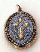 Victorian oval blue and black enamel locket, the front with an engraved cross design entwined with
