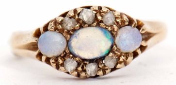 18ct gold opal and diamond ring, a line of three graduated opals, highlighted between with six small