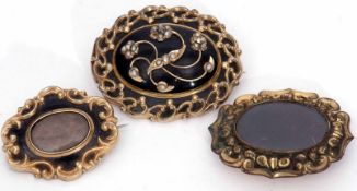 Mixed Lot: of three Victorian memoriam brooches, large black onyx and seed pearl example with glazed