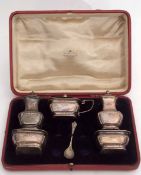 George V cased Art Nouveau style five-piece cruet set comprising two pepper casters and open salts