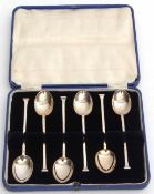 Cased set of six George V seal top coffee spoons in a silk and velvet lined blue fitted case,