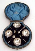 Victorian cased set of four open salts, each of plain and polished circular form and raised on three