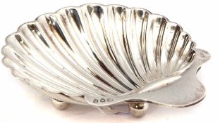 Victorian shell butter dish of typical form raised on three ball feet, length 12 1/2cm, weight