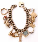 Gilt metal curb link bracelet suspending various 9ct gold charms to include a small wedding ring,