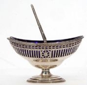 Edward VII silver swing handled sugar basket of oval form with beaded and applied rim and hinged